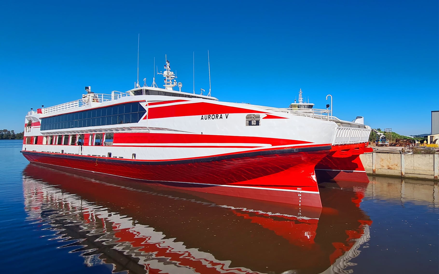 Aurora V sitting in dock at Yamba freshly painted,