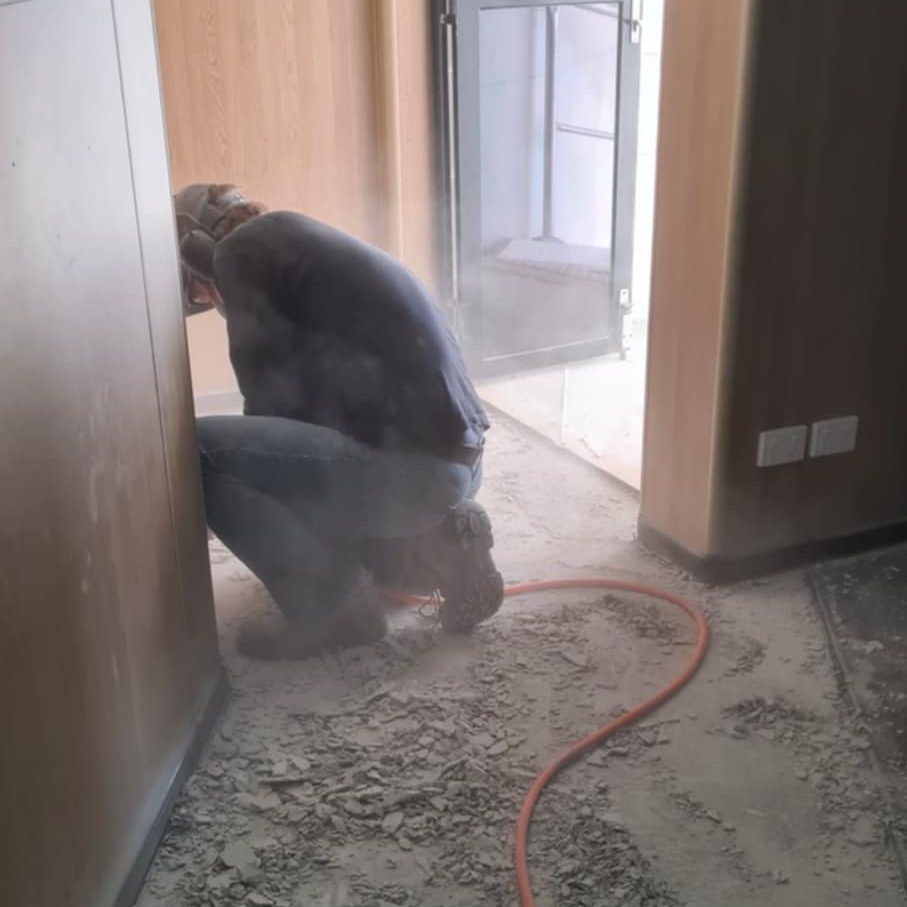 Contractor working on replacing the floor in the upstairs accommodation area.