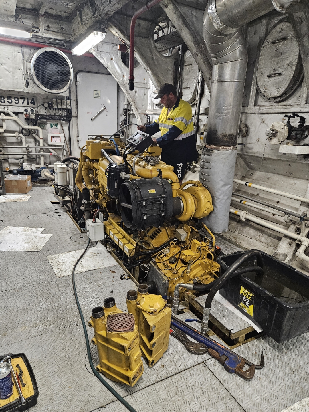 Mechanic servicing the port (left) engine.